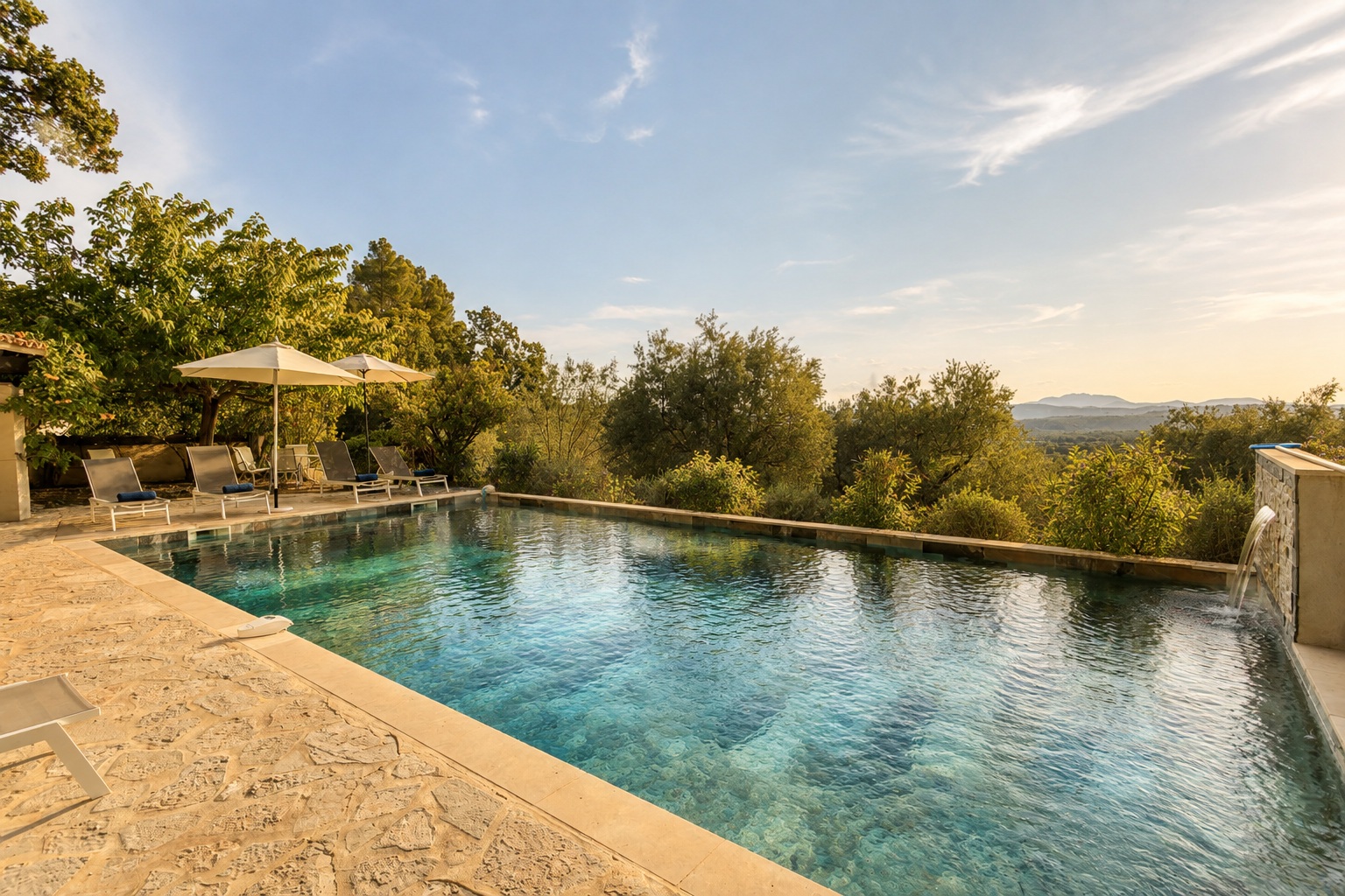 The infinity pool overlooking the valley at golden hour